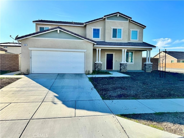 view of front of property featuring driveway, covered porch, a garage, and stucco siding