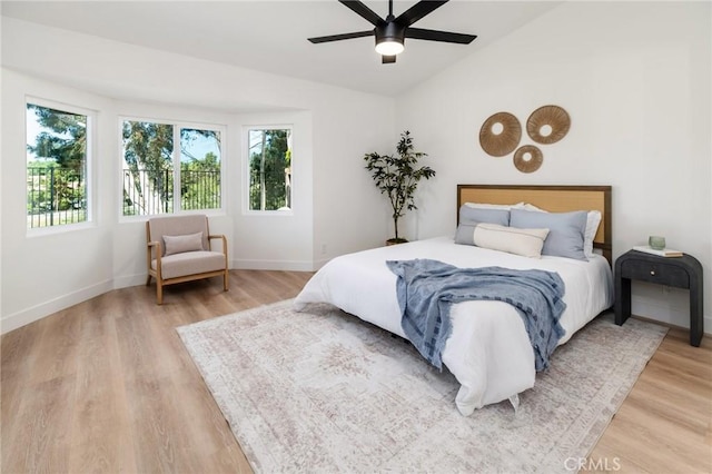 7969 Calle Madrid, Carlsbad, CA 92009 - bedroom with light wood-type flooring, baseboards, lofted ceiling, and ceiling fan