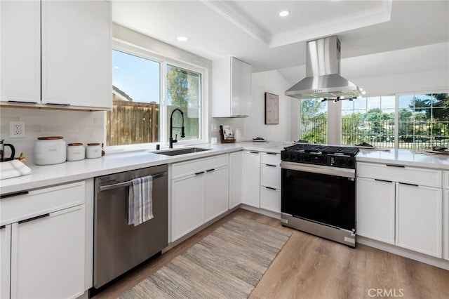 7969 Calle Madrid, Carlsbad, CA 92009 - kitchen with dishwasher, wall chimney exhaust hood, gas range, a sink, and healthy amount of natural light