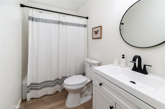 7969 Calle Madrid, Carlsbad, CA 92009 - full bathroom featuring toilet, vanity, and wood finished floors