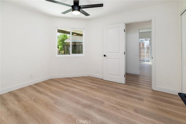7969 Calle Madrid, Carlsbad, CA 92009 - unfurnished bedroom with baseboards, light wood-style flooring, and ceiling fan