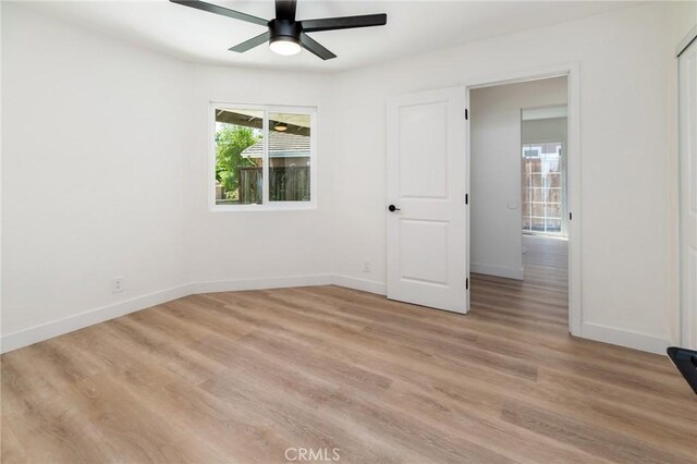 7969 Calle Madrid, Carlsbad, CA 92009 - unfurnished bedroom with baseboards, light wood-style flooring, and a ceiling fan