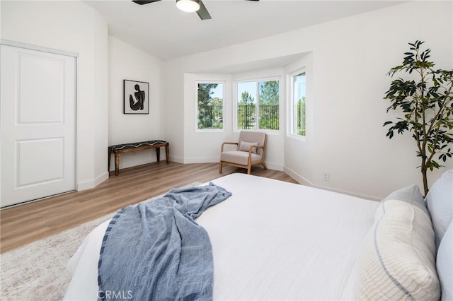 7969 Calle Madrid, Carlsbad, CA 92009 - bedroom featuring light wood finished floors, vaulted ceiling, a ceiling fan, and baseboards