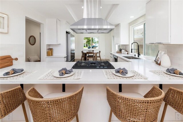 7969 Calle Madrid, Carlsbad, CA 92009 - kitchen featuring exhaust hood, a sink, stainless steel refrigerator, white cabinetry, and recessed lighting