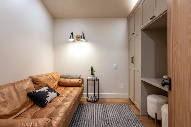 interior space with baseboards and wood finished floors