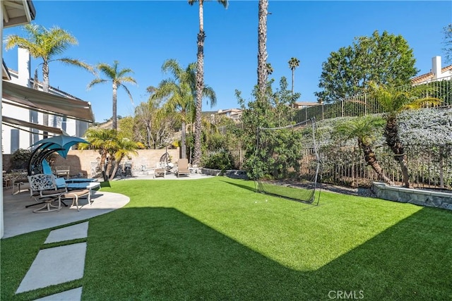 view of yard with a patio area and a fenced backyard