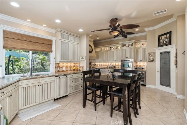 dining area with light tile patterned floors, visible vents, ceiling fan, crown molding, and recessed lighting