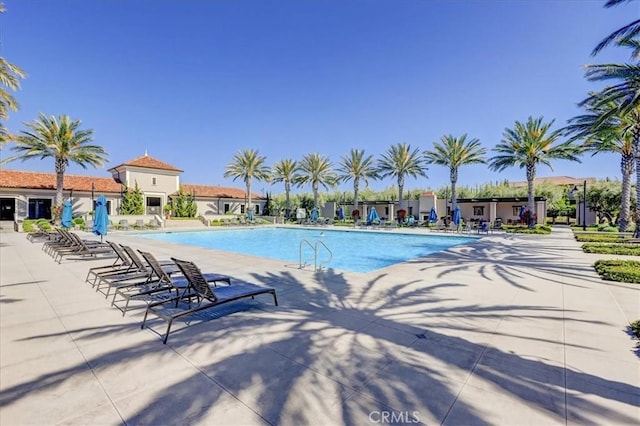 pool with a patio area