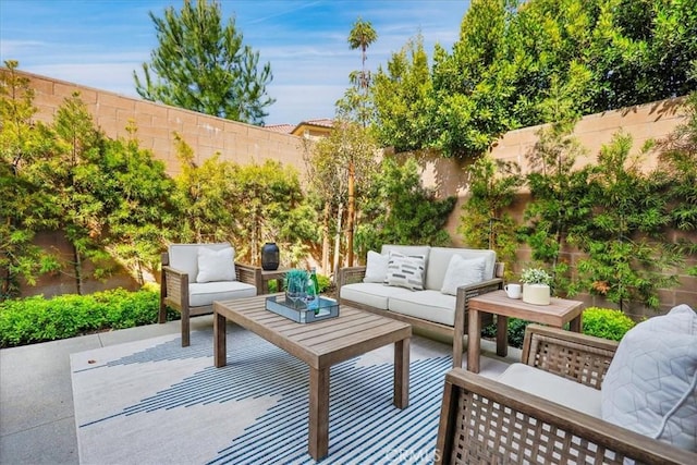 view of patio with a fenced backyard and an outdoor living space