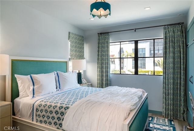 bedroom with wood finished floors