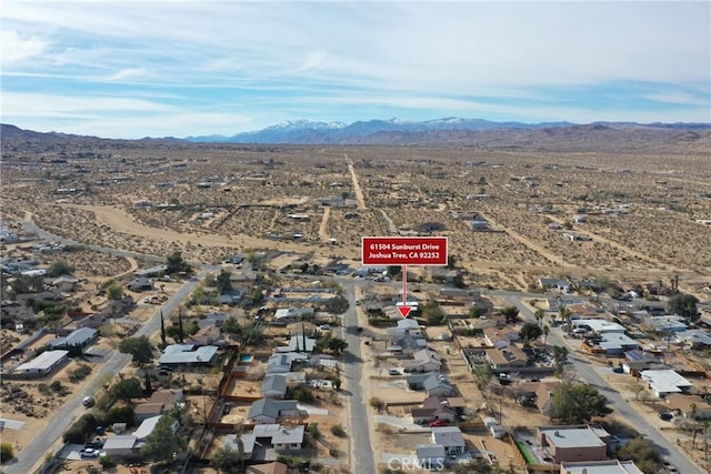 birds eye view of property with a residential view and a mountain view