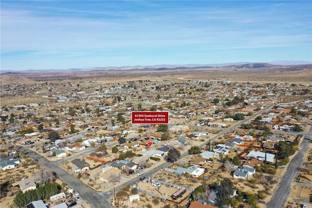 birds eye view of property with a residential view and a mountain view