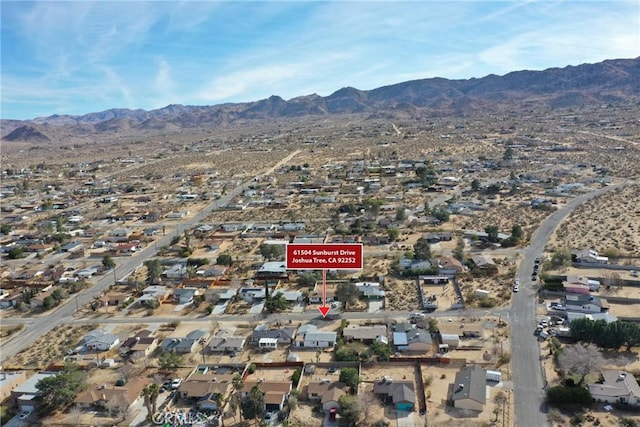 birds eye view of property with a residential view and a mountain view