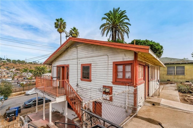 view of front of home featuring fence