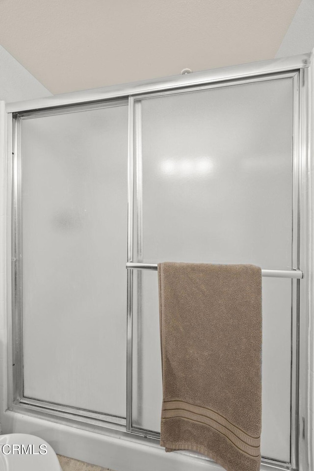 full bath with a shower with door