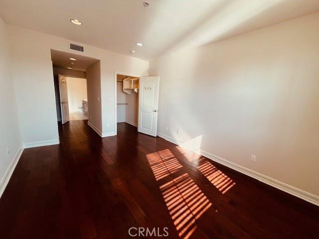 14242 Burbank Blvd Unit 103, Sherman Oaks, CA 91401 - unfurnished bedroom featuring baseboards, wood finished floors, recessed lighting, and a closet