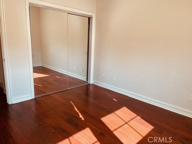 14242 Burbank Blvd Unit 103, Sherman Oaks, CA 91401 - unfurnished bedroom with wood finished floors and a closet