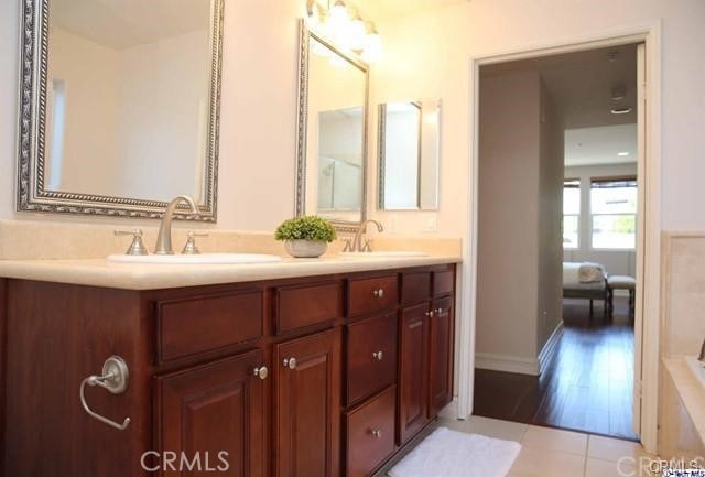 14242 Burbank Blvd Unit 103, Sherman Oaks, CA 91401 - full bathroom featuring double vanity, tile patterned floors, and baseboards