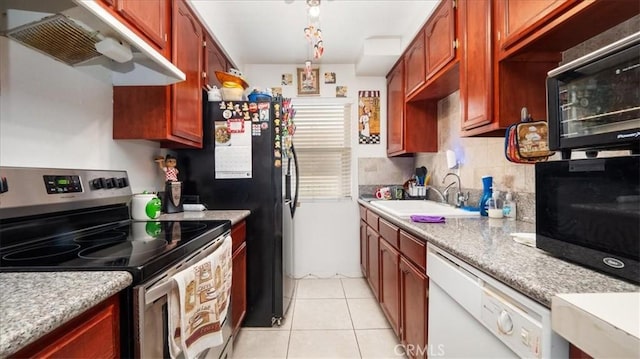 kitchen featuring electric range, a sink, ventilation hood, light countertops, and backsplash