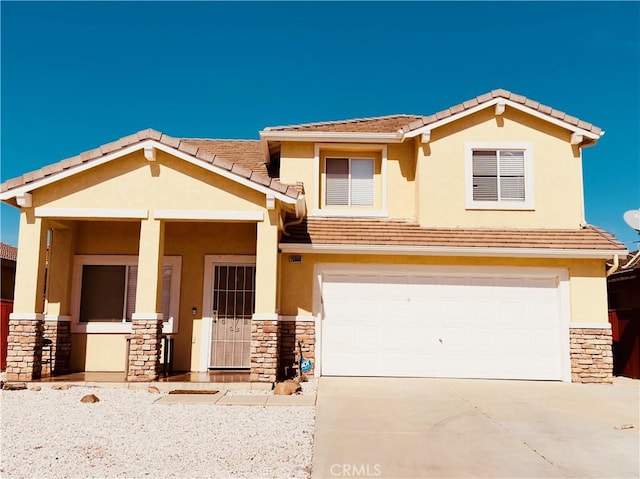 view of front of property with stone siding, an attached garage, concrete driveway, and stucco siding