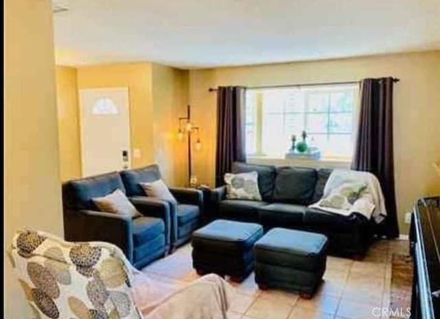 living area with light tile patterned floors