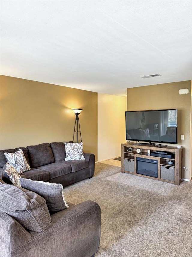 living room featuring carpet floors and visible vents