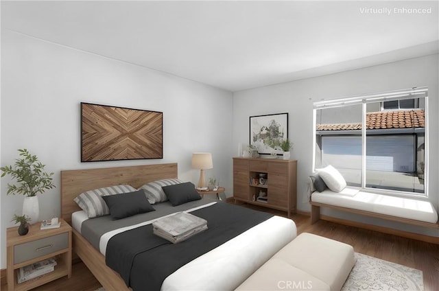 bedroom with wood finished floors