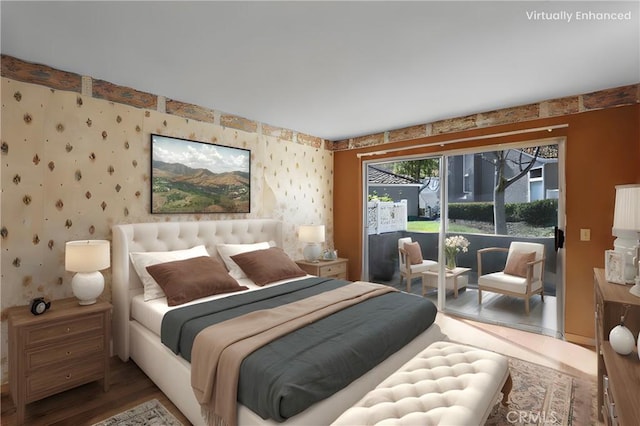 bedroom featuring access to exterior, wallpapered walls, and wood finished floors