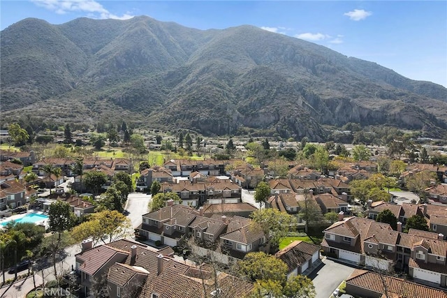 drone / aerial view featuring a residential view and a mountain view