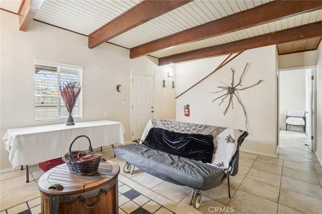 sitting room with light tile patterned floors, wood ceiling, beam ceiling, and baseboards