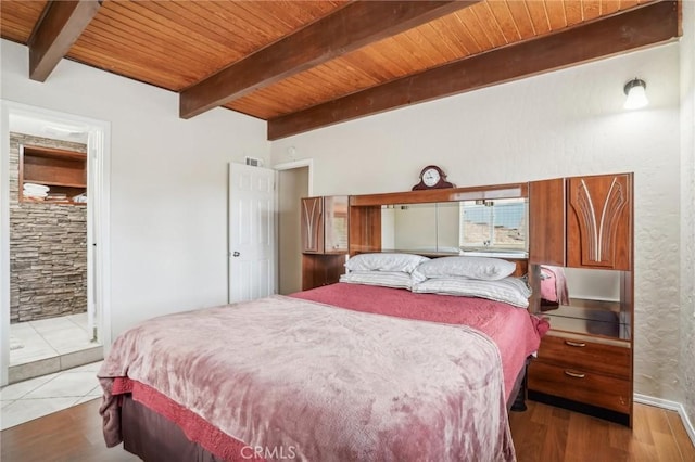 bedroom featuring wooden ceiling, visible vents, beamed ceiling, and light wood-style flooring