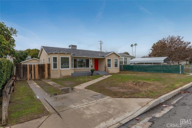 bungalow with fence and stucco siding