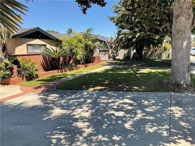 268 E 18th St, Costa Mesa, CA 92627 - obstructed view of property with stucco siding and brick siding