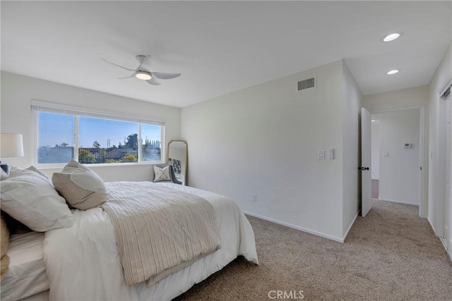 bedroom featuring recessed lighting, visible vents, a ceiling fan, light carpet, and baseboards