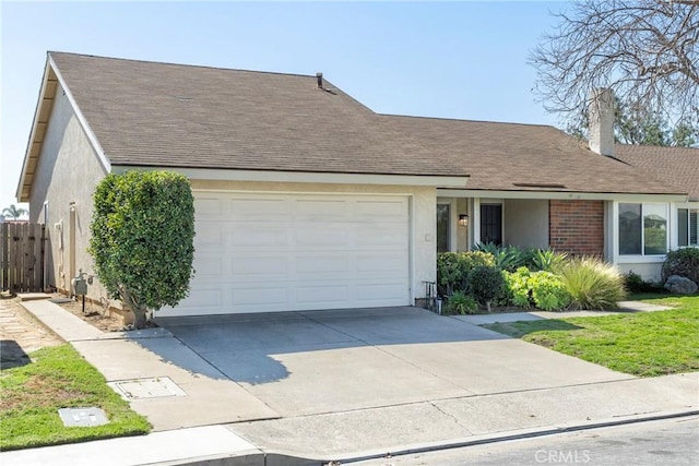 ranch-style house featuring a garage, driveway, a shingled roof, and stucco siding