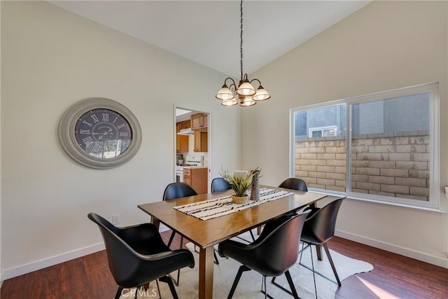 dining area featuring an inviting chandelier, baseboards, vaulted ceiling, and dark wood finished floors