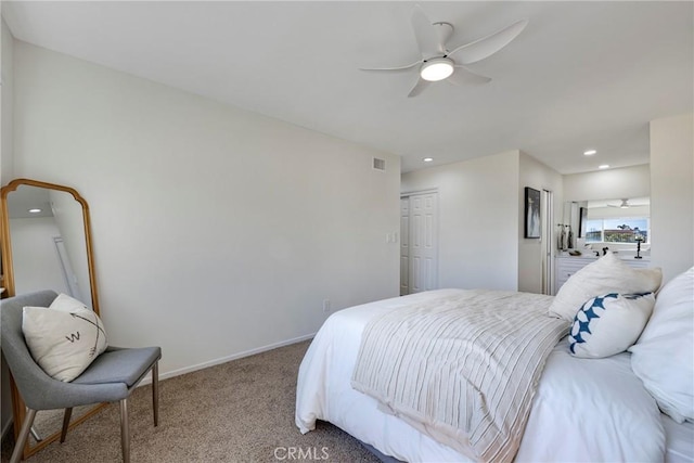 carpeted bedroom with recessed lighting, a closet, visible vents, ceiling fan, and baseboards