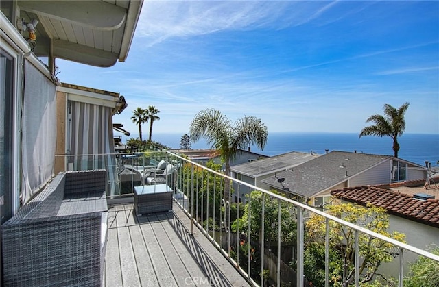 balcony featuring a water view