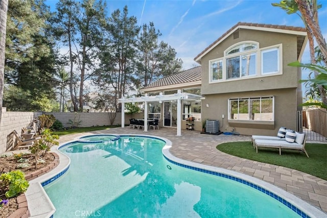 rear view of house featuring a fenced backyard, an in ground hot tub, a tile roof, stucco siding, and a pergola