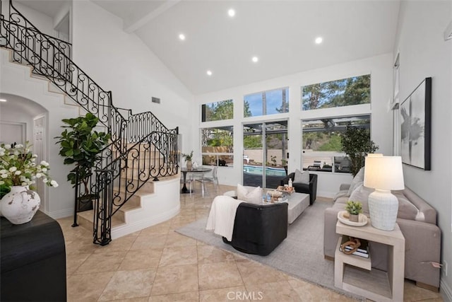 living room featuring high vaulted ceiling, visible vents, stairway, and recessed lighting