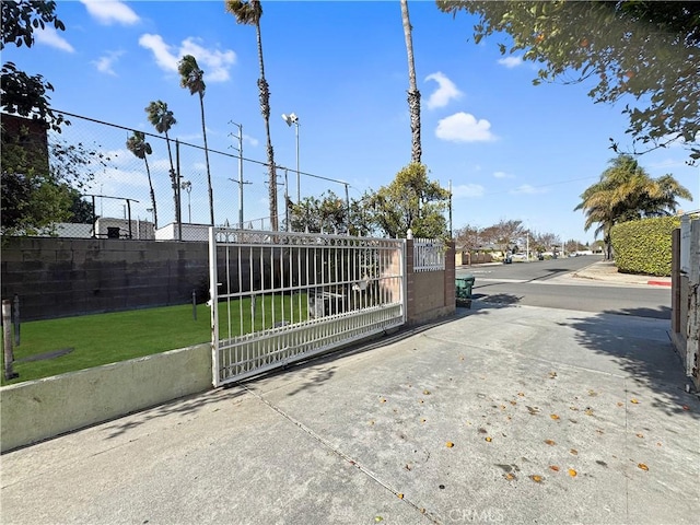 view of gate with fence