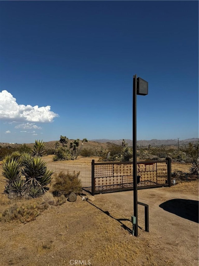 view of yard featuring a gate and fence