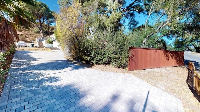 exterior space featuring decorative driveway