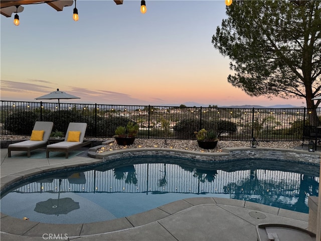 view of pool with a patio area, fence, and a fenced in pool