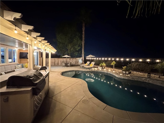 view of swimming pool featuring a fenced in pool, a patio area, and a fenced backyard