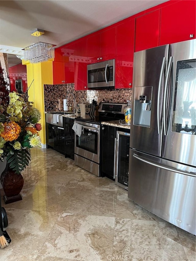 kitchen with wine cooler, red cabinets, stainless steel appliances, backsplash, and modern cabinets