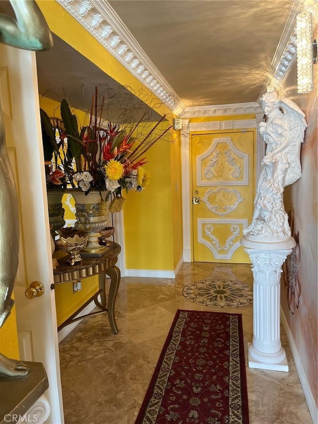 hallway with ornamental molding and baseboards