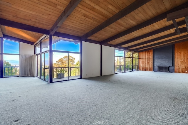 2229 Via Cerritos, Palos Verdes Estates, CA 90274 - unfurnished living room with floor to ceiling windows, beam ceiling, wood ceiling, plenty of natural light, and carpet