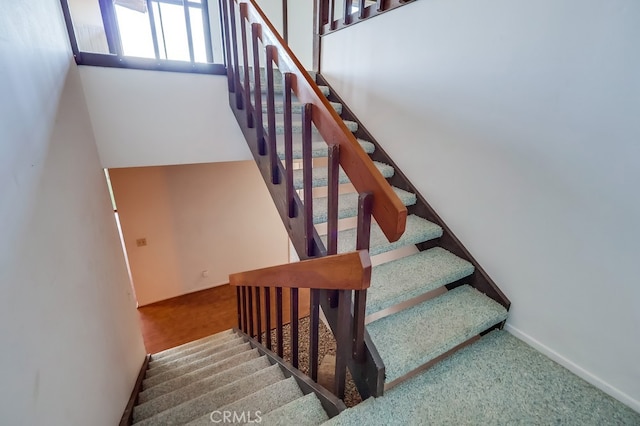 stairs featuring baseboards