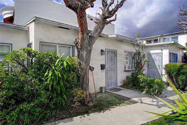view of front of house featuring stucco siding